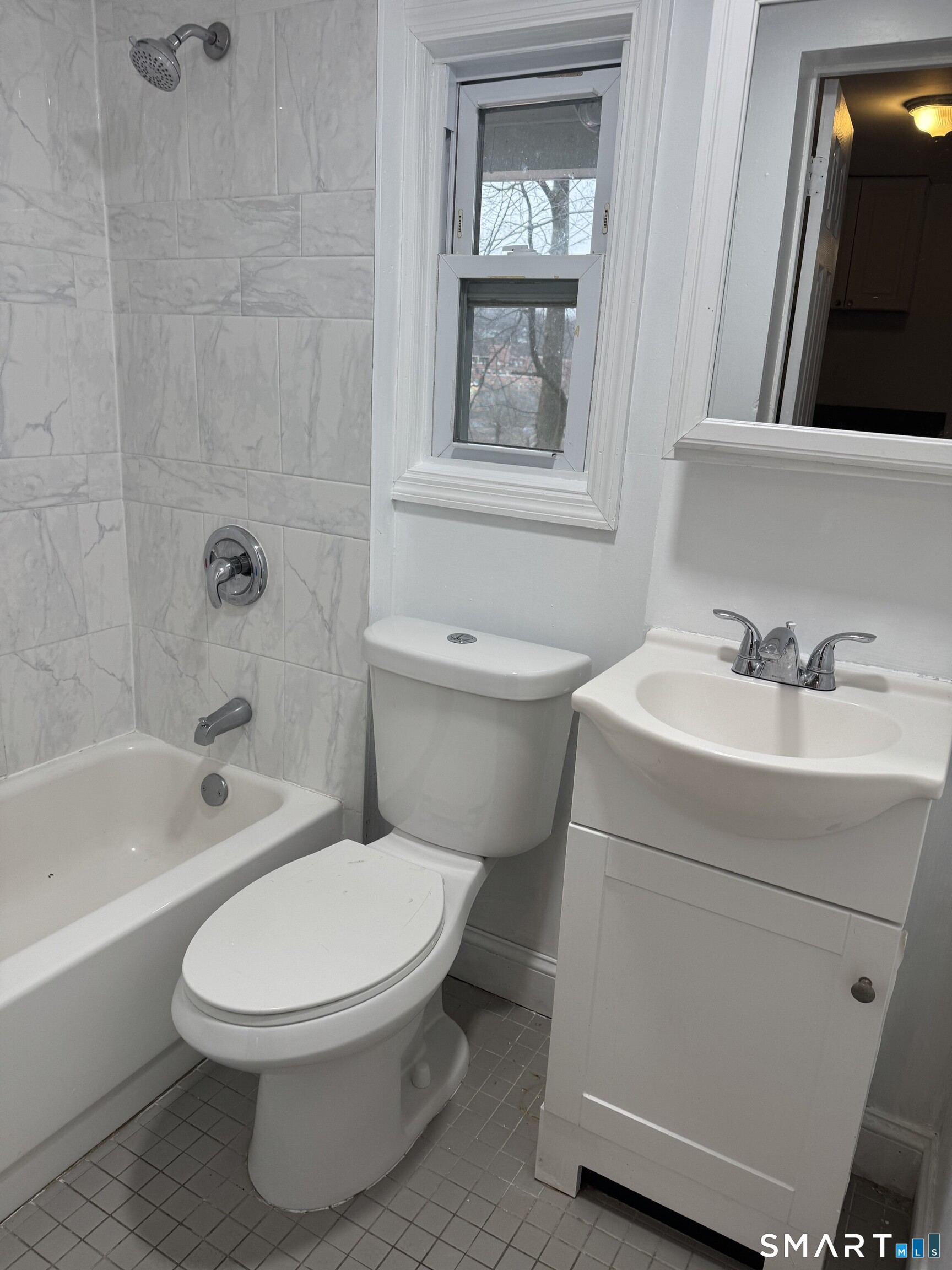 Undisclosed Address Ansonia, CT 06401 - Photo 16 of 20 a white toilet sitting next to a bath tub