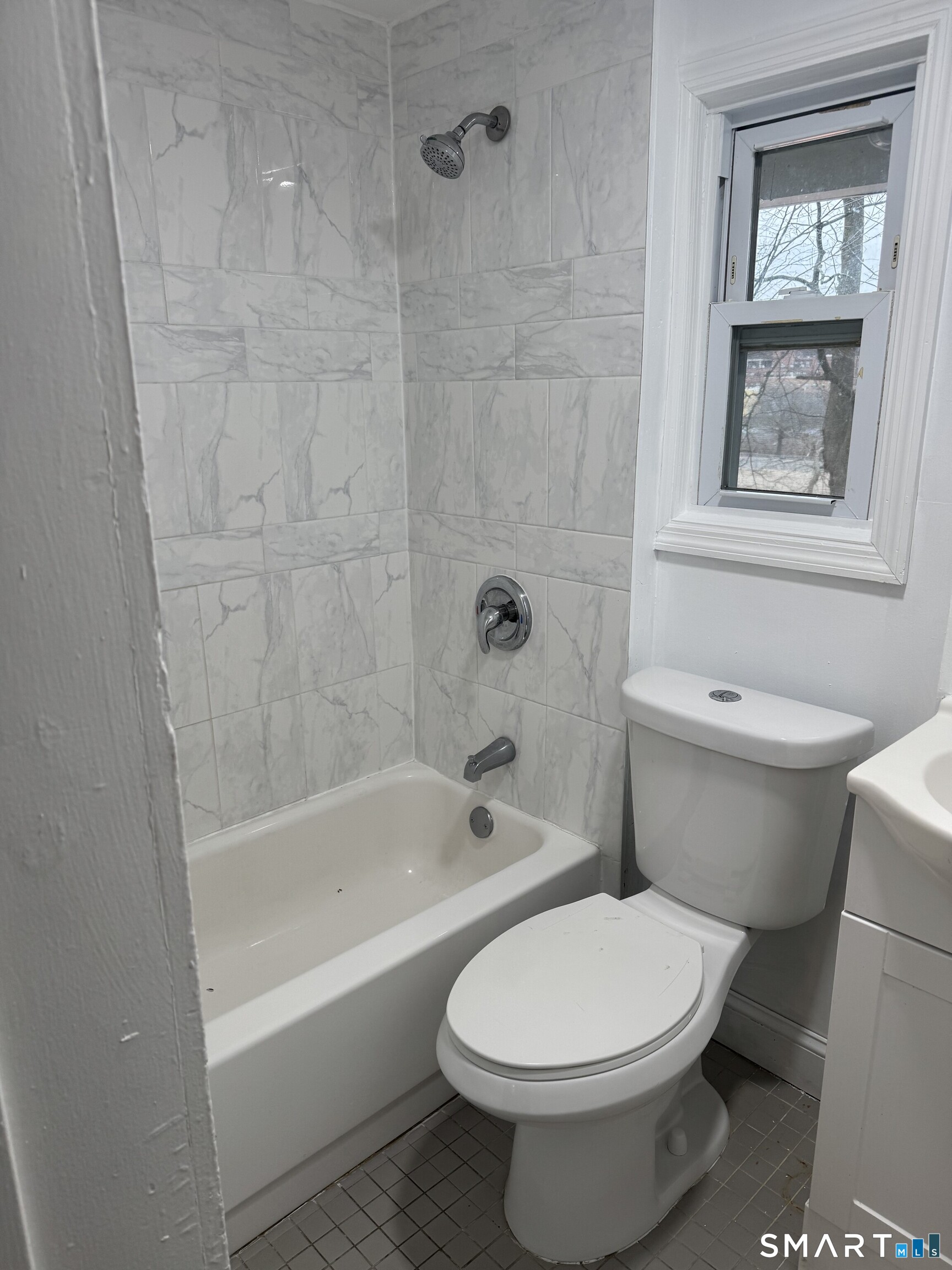 Undisclosed Address Ansonia, CT 06401 - Photo 17 of 20 a white toilet sitting next to a bath tub