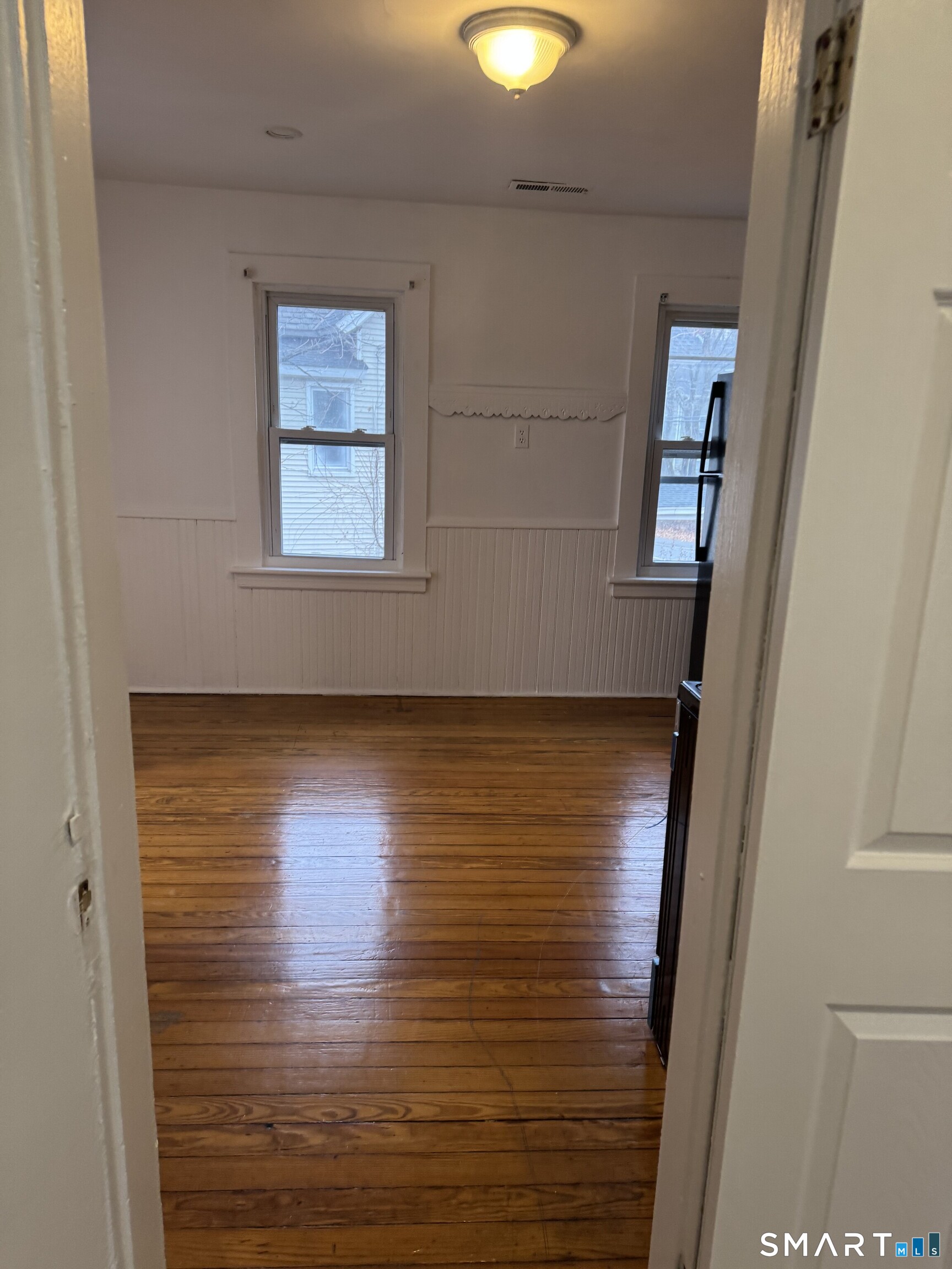 Undisclosed Address Ansonia, CT 06401 - Photo 5 of 20 a view of room with window and hardwood floor