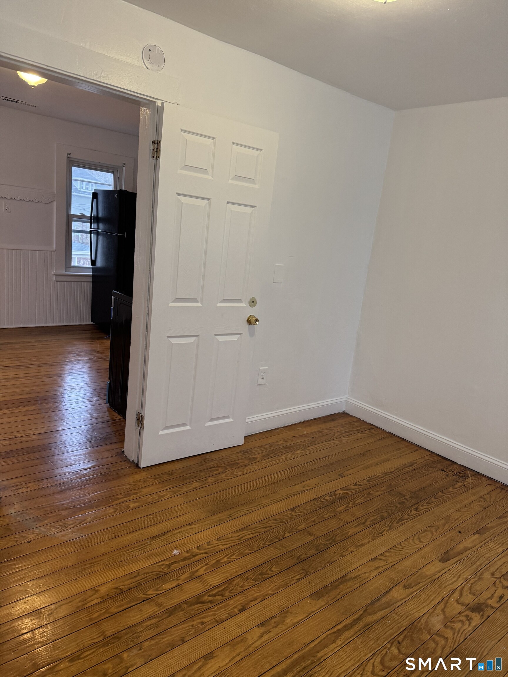 Undisclosed Address Ansonia, CT 06401 - Photo 6 of 20 a view of a room with wooden floor and windows