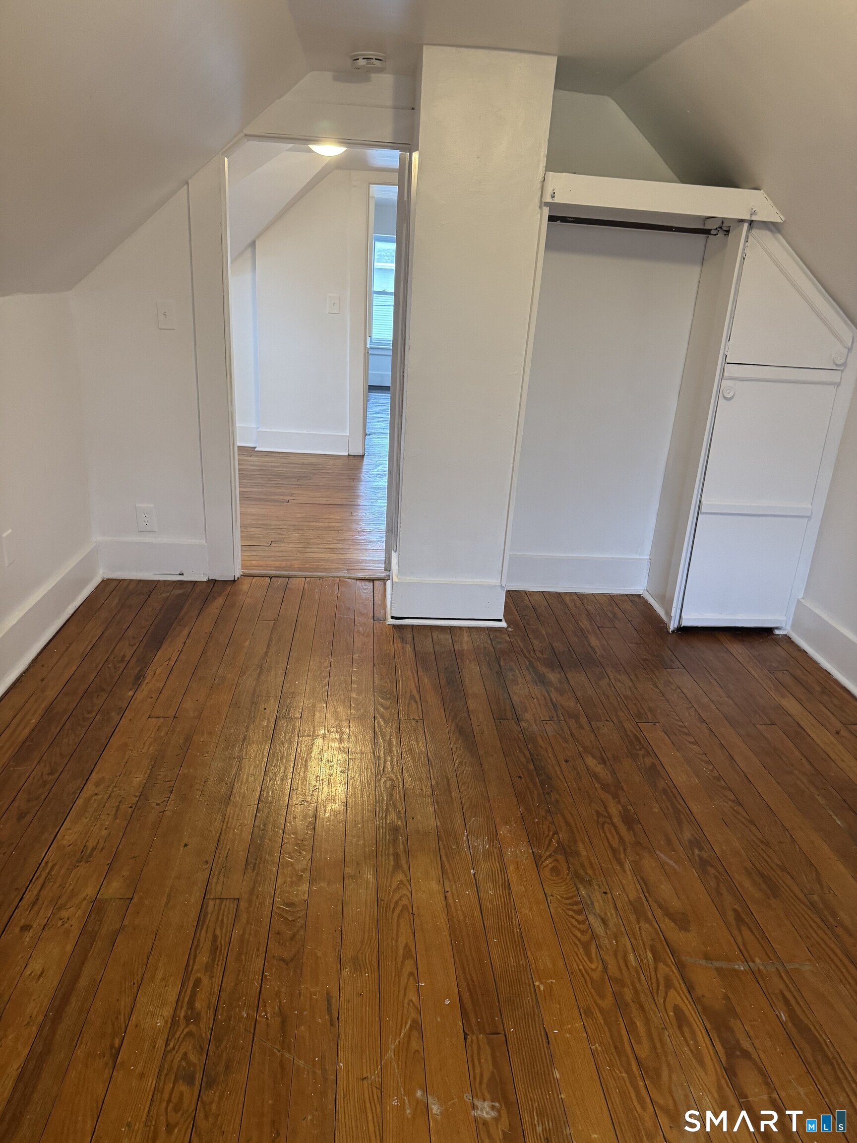 Undisclosed Address Ansonia, CT 06401 - Photo 10 of 20 a view of an empty room with wooden floor