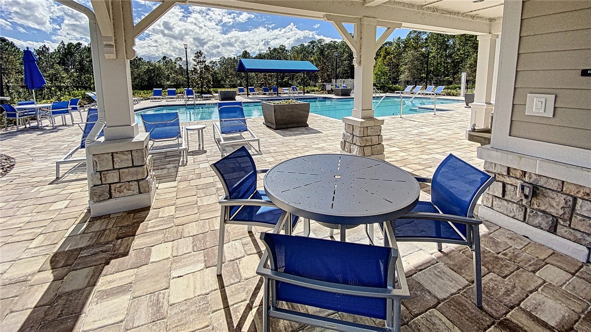 93015 Cope Court Fernandina Beach, FL 32034 - Photo 12 of 23 a view of a dining room with furniture window and outside view