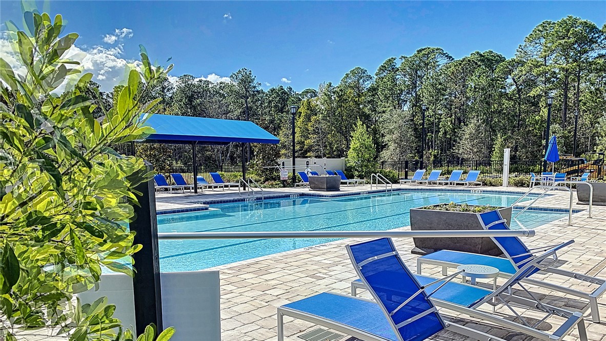 93015 Cope Court Fernandina Beach, FL 32034 - Photo 17 of 23 a view of a yard with furniture
