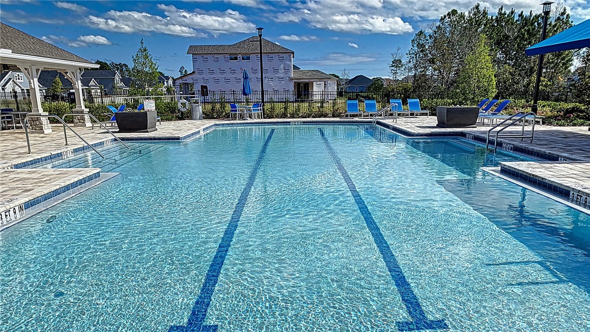 93015 Cope Court Fernandina Beach, FL 32034 - Photo 20 of 23 a view of a swimming pool with sitting area