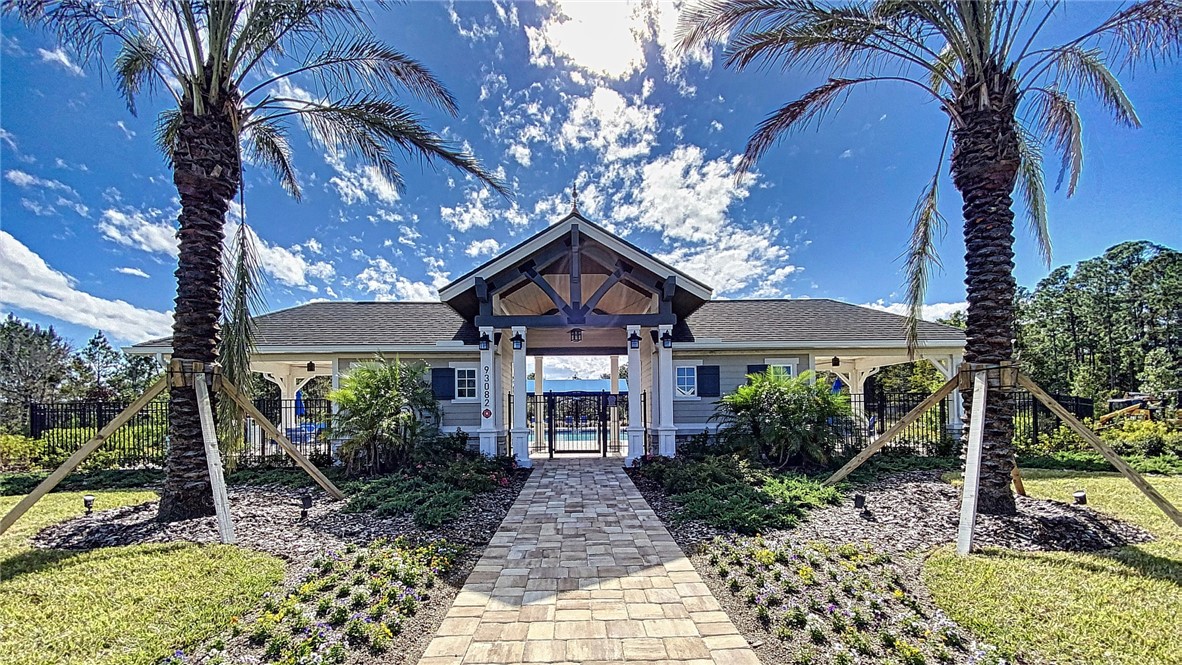93015 Cope Court Fernandina Beach, FL 32034 - Photo 4 of 23 a front view of a house with garden