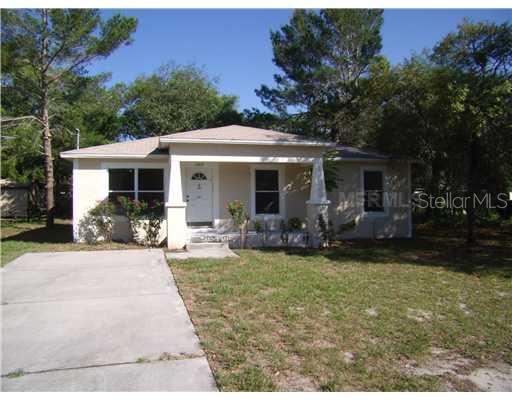 12419 Lamont Avenue New Port Richey, FL 34654 - Photo 1 of 1 a view of a house with backyard sitting area and garden