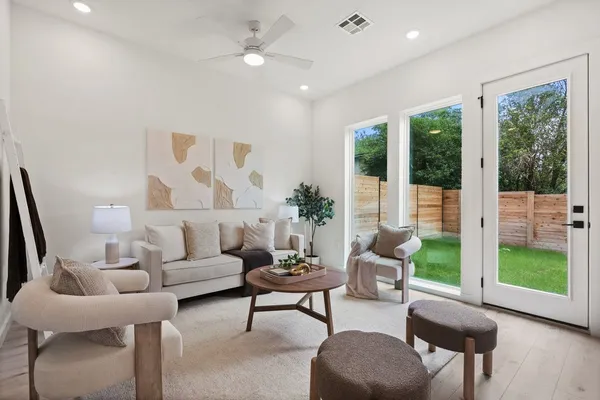 a living room with furniture and a large window