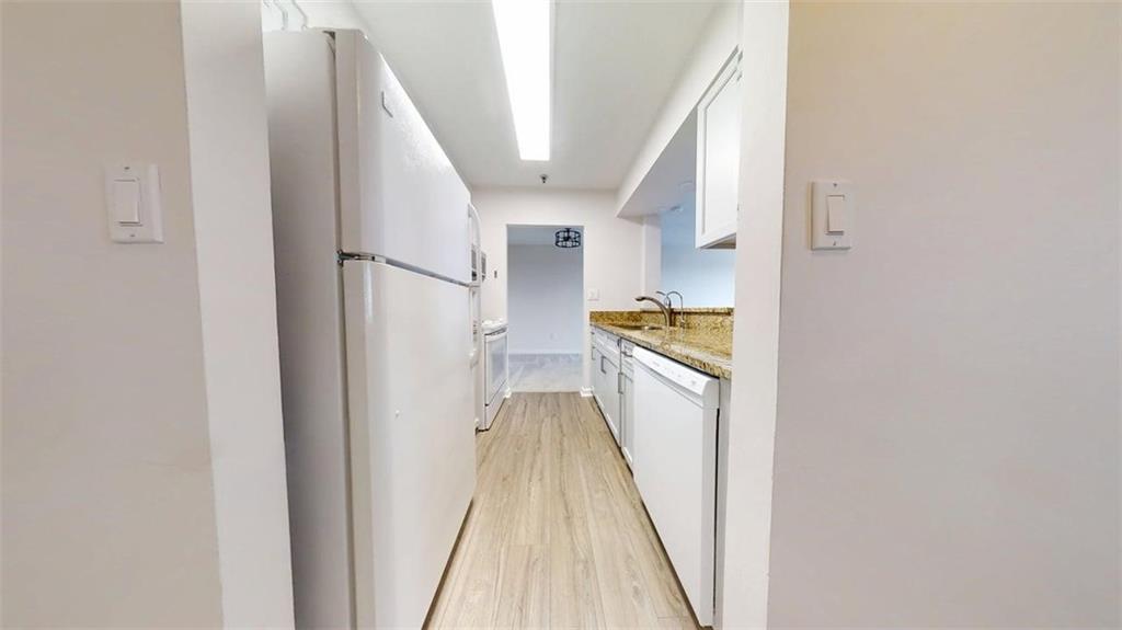 300 Johnson Ferry Road, Unit B805 Sandy Springs, GA 30328 - Photo 18 of 31 a view of a kitchen from the hallway