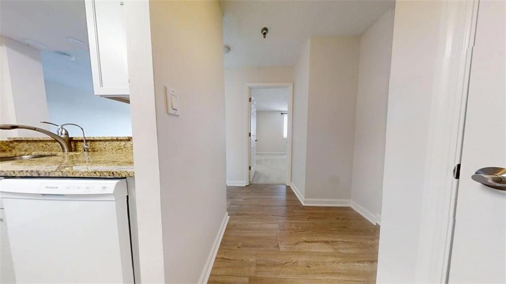 300 Johnson Ferry Road, Unit B805 Sandy Springs, GA 30328 - Photo 19 of 31 a bathroom with a granite countertop sink and a mirror