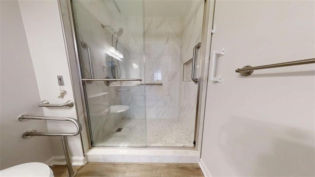 300 Johnson Ferry Road, Unit B805 Sandy Springs, GA 30328 - Photo 25 of 31 a bathroom with a granite countertop shower and toilet