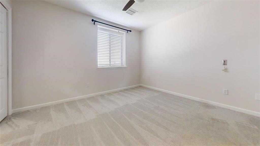 300 Johnson Ferry Road, Unit B805 Sandy Springs, GA 30328 - Photo 5 of 31 an empty room with windows