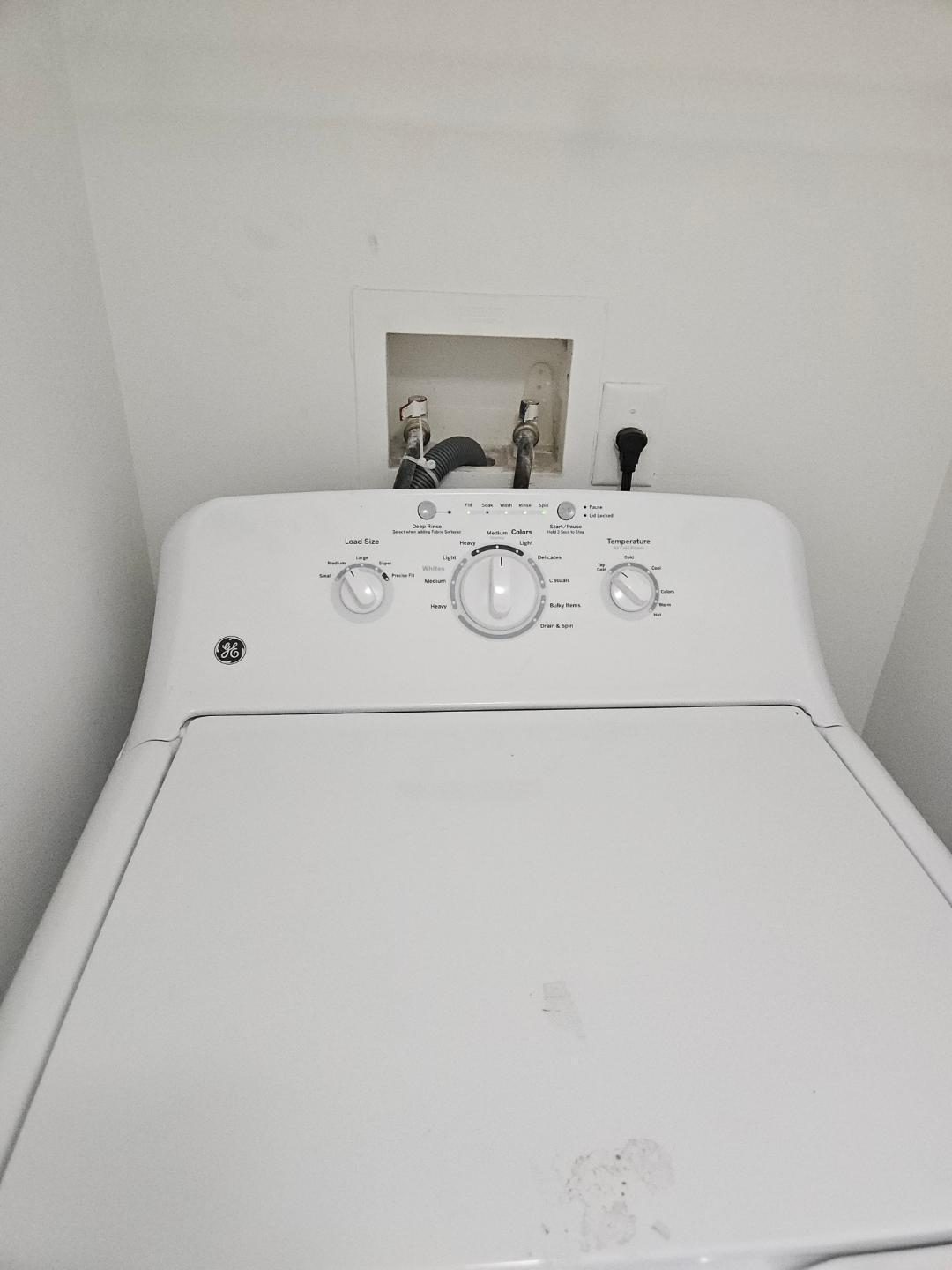 5011 Wiles Road, Unit 308 Coconut Creek, FL 33073 - Photo 12 of 12 a utility room with dryer and washer