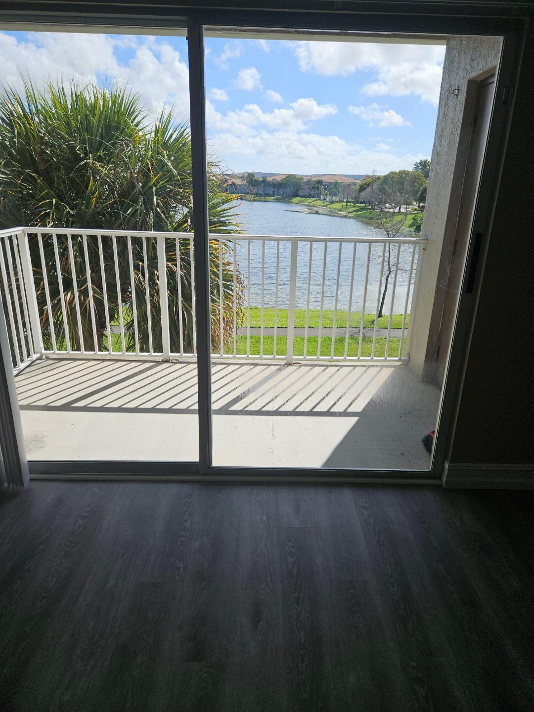 5011 Wiles Road, Unit 308 Coconut Creek, FL 33073 - Photo 2 of 12 a view of outdoor space and deck