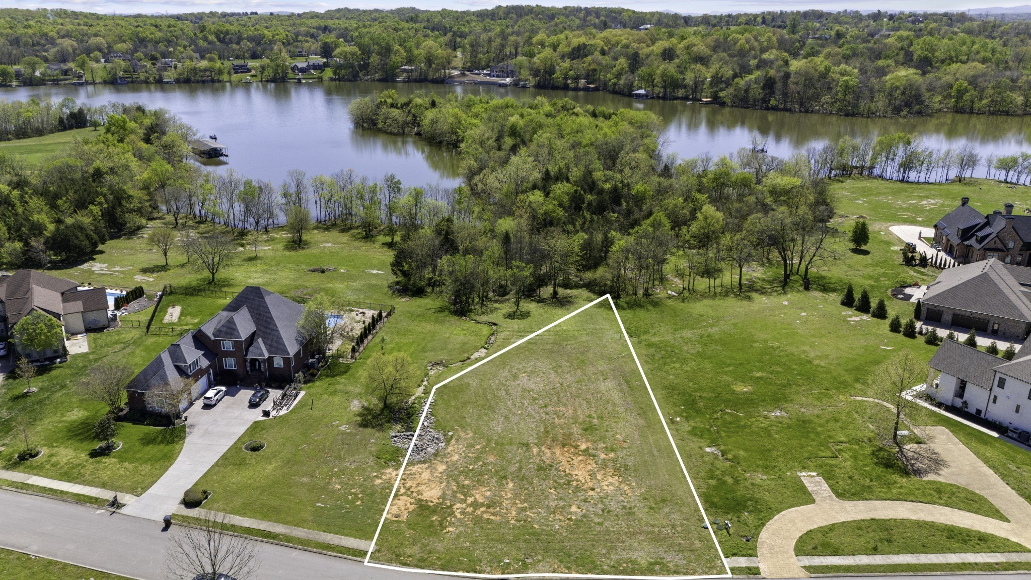 304 Stonebrook Point Lebanon, TN 37087 - Photo 2 of 8 a view of a lake with a houses