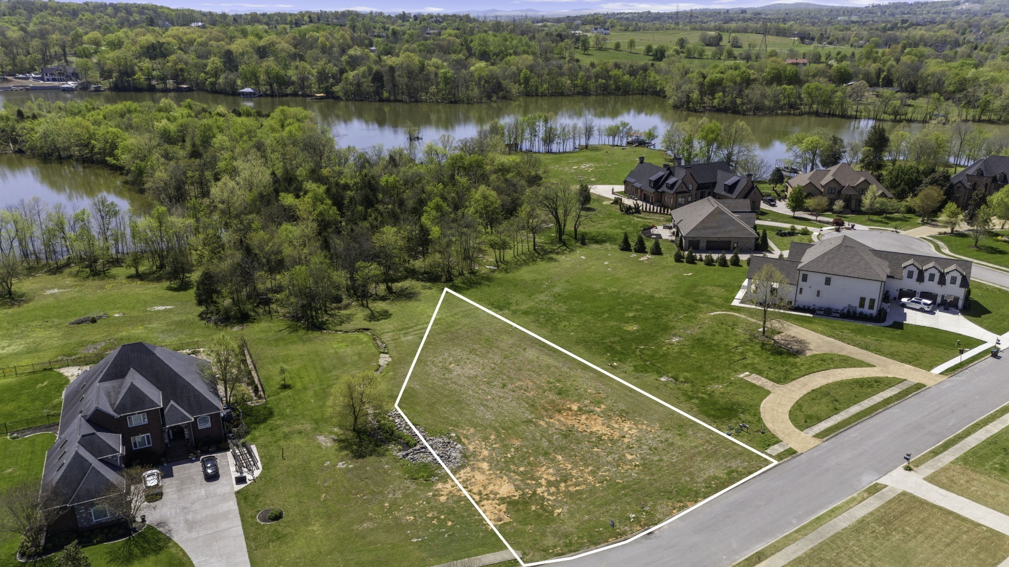 304 Stonebrook Point Lebanon, TN 37087 - Photo 7 of 8 a view of a lake with a yard
