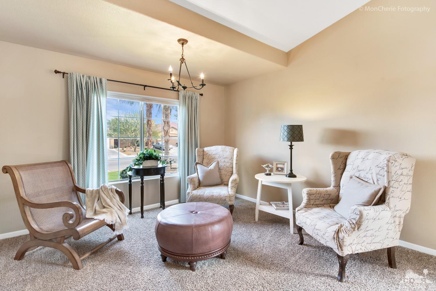 41675 Front Hall Road Bermuda Dunes, CA 92203 - Photo 12 of 23 a living room with furniture and a chandelier