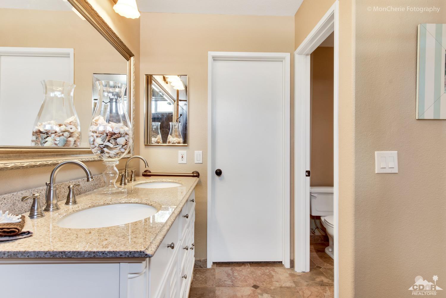 41675 Front Hall Road Bermuda Dunes, CA 92203 - Photo 15 of 23 a bathroom with sinks granite countertop a sink and a mirror