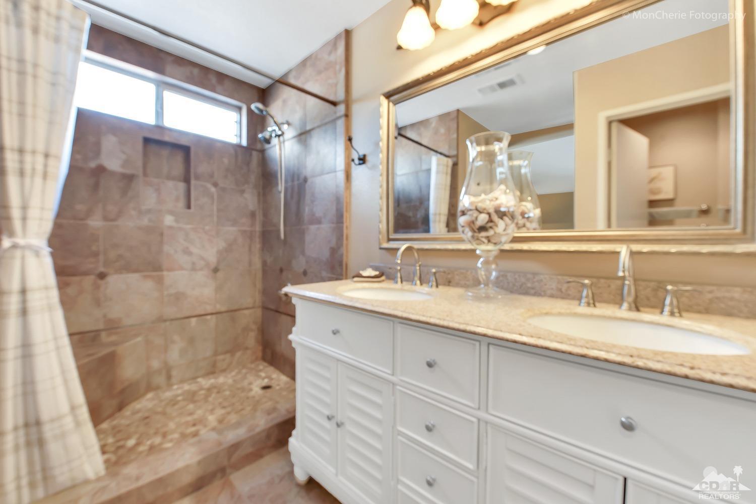 41675 Front Hall Road Bermuda Dunes, CA 92203 - Photo 16 of 23 a bathroom with a granite countertop sink mirror and