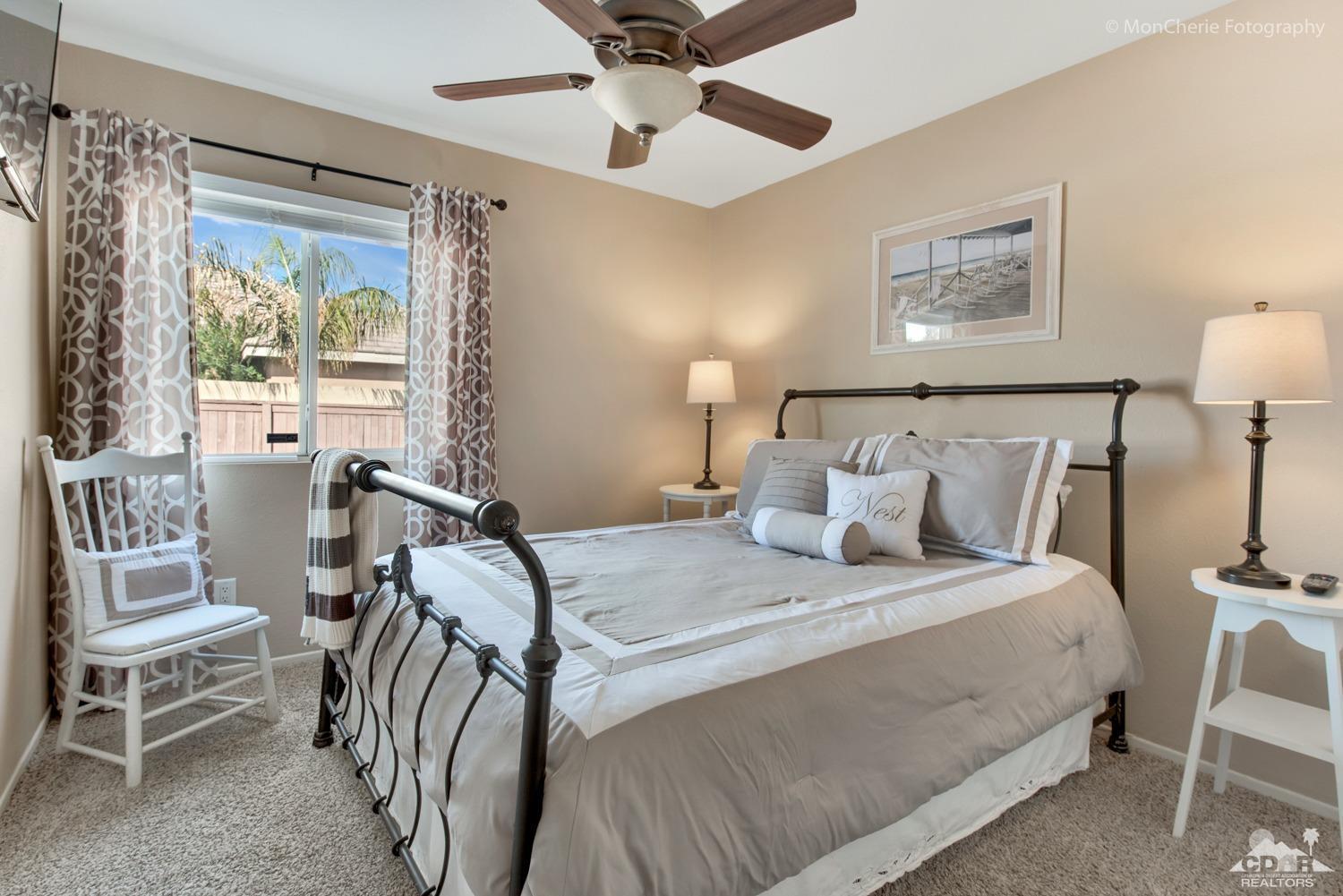41675 Front Hall Road Bermuda Dunes, CA 92203 - Photo 17 of 23 a bedroom with a bed and a table