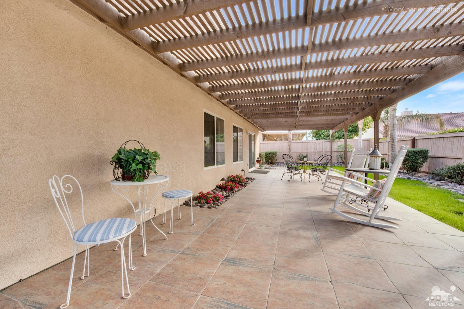 41675 Front Hall Road Bermuda Dunes, CA 92203 - Photo 21 of 23 a view of a porch with furniture and garden