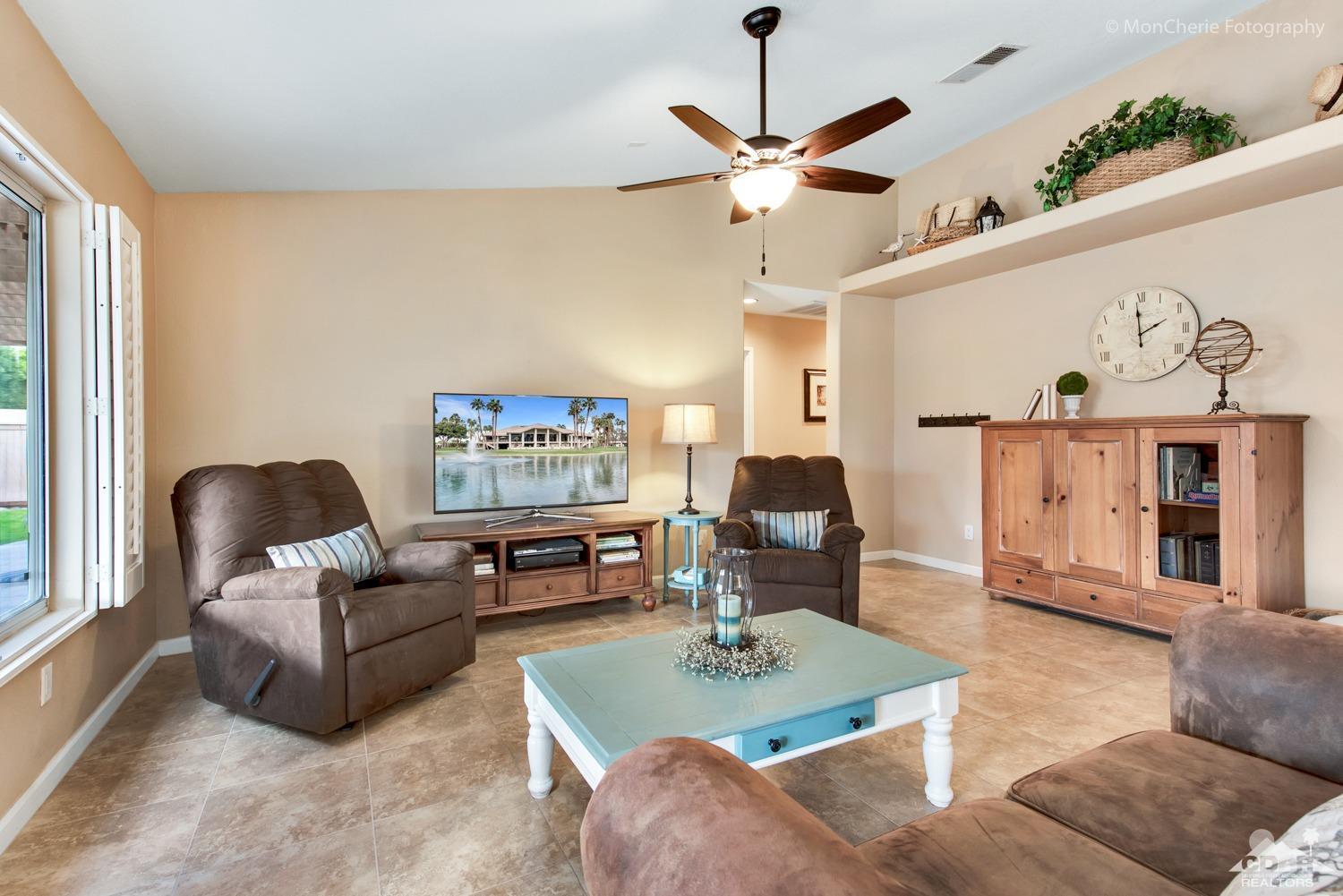 41675 Front Hall Road Bermuda Dunes, CA 92203 - Photo 10 of 23 a living room with furniture and a chandelier