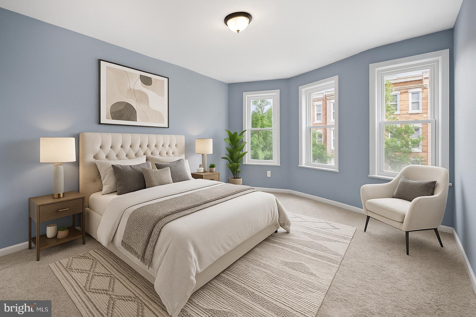 a bedroom with a bed and a couch next to a window