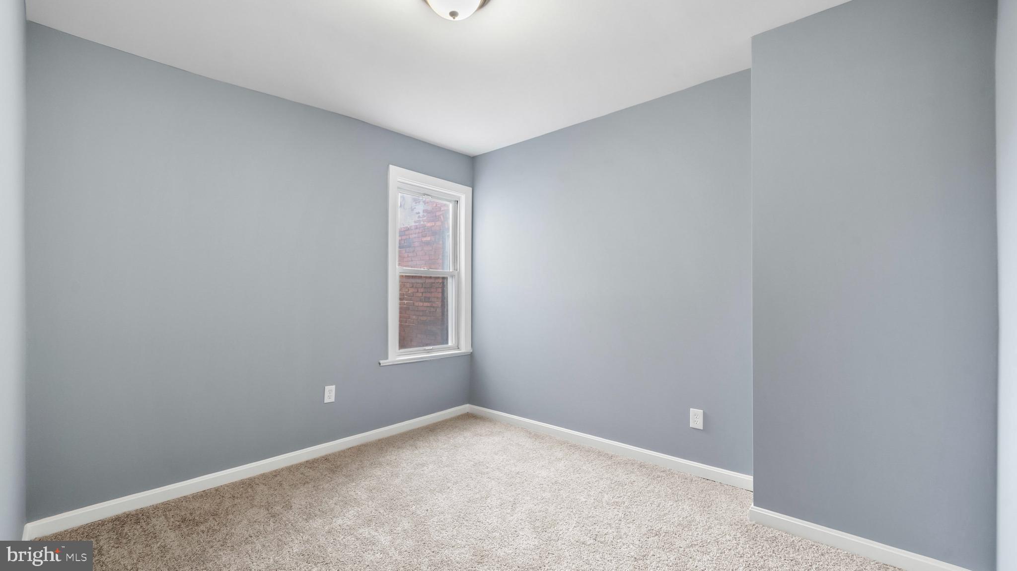 1919 Mosher Street Baltimore, MD 21217 - Photo 14 of 21 an empty room with a window