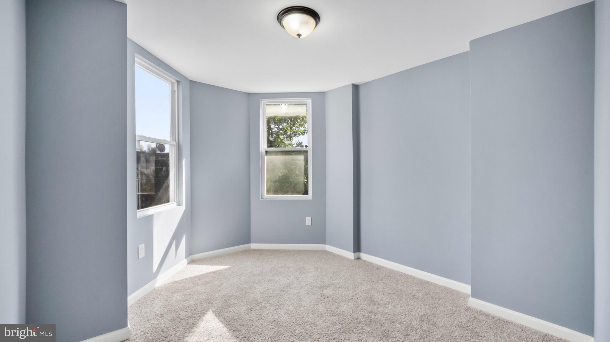 1919 Mosher Street Baltimore, MD 21217 - Photo 16 of 21 a view of an empty room with a window