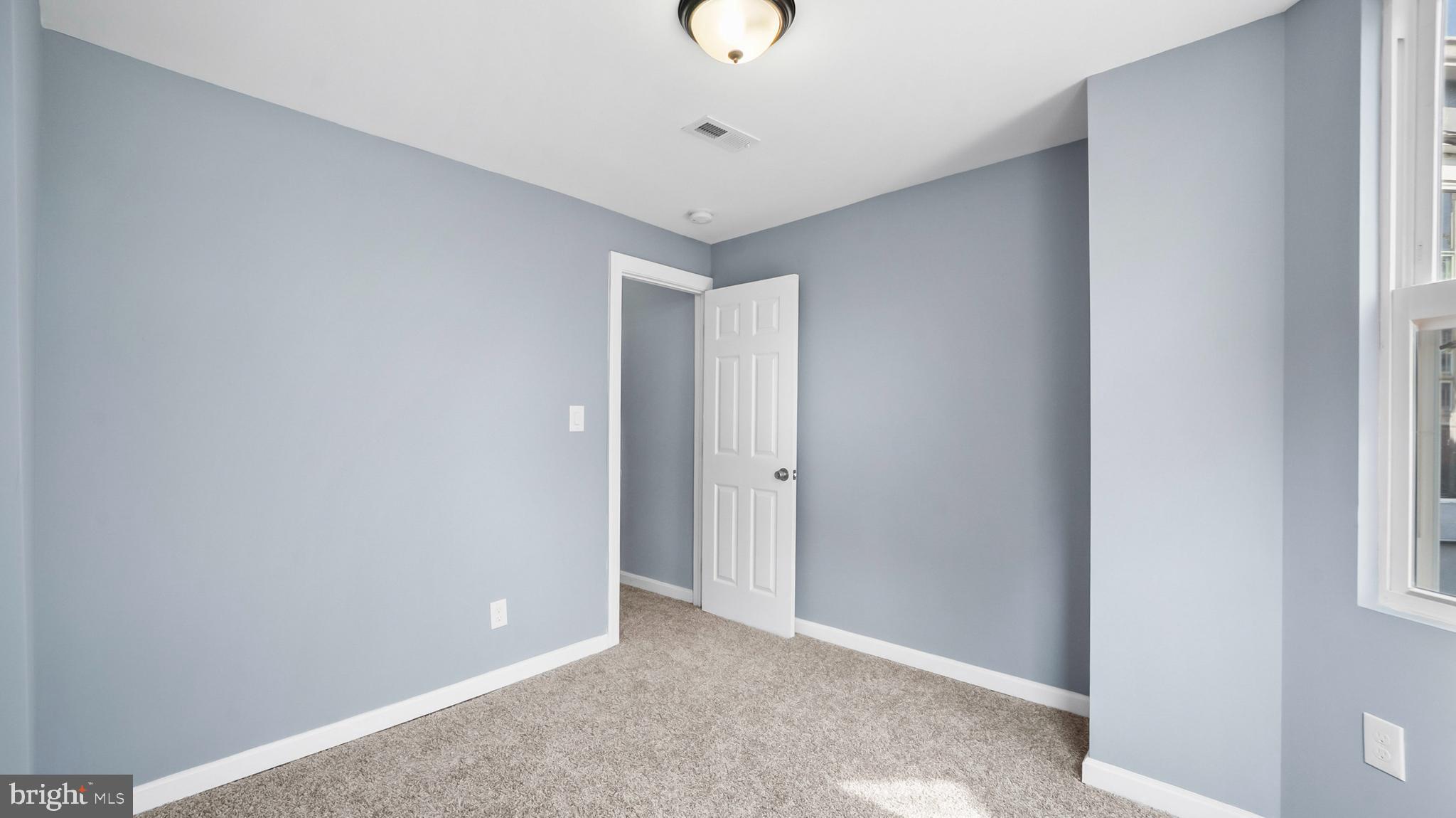 1919 Mosher Street Baltimore, MD 21217 - Photo 18 of 21 a view of an empty room with a window
