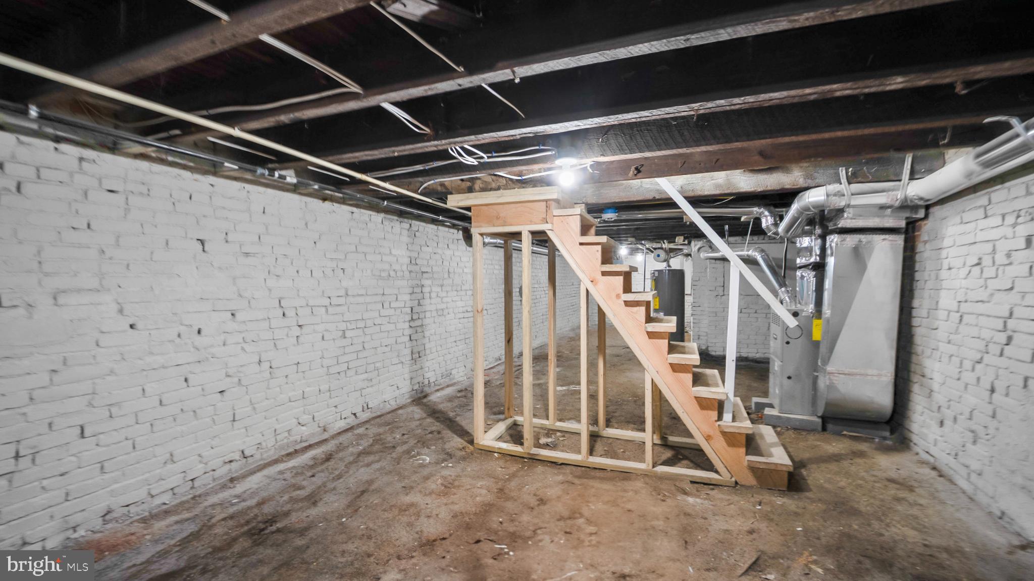 1919 Mosher Street Baltimore, MD 21217 - Photo 19 of 21 a view of an empty room with wooden floor
