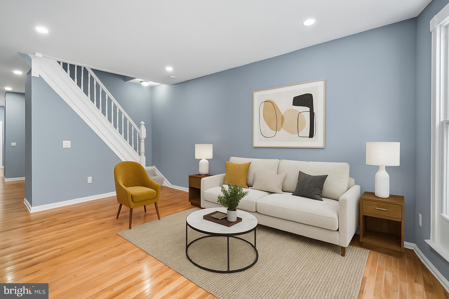 1919 Mosher Street Baltimore, MD 21217 - Photo 2 of 21 a living room with furniture and a wooden floor