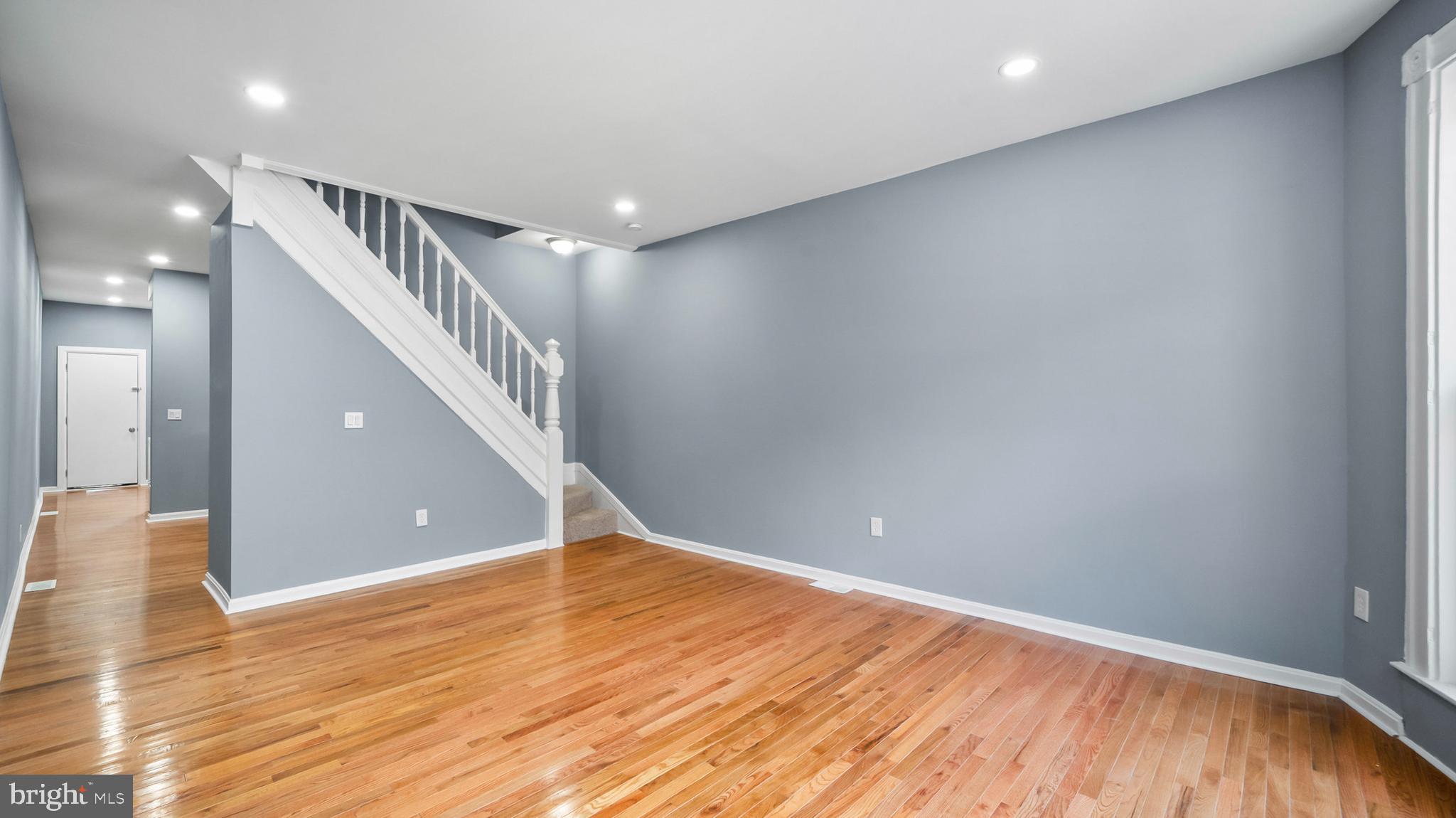 1919 Mosher Street Baltimore, MD 21217 - Photo 3 of 21 a view of empty room with wooden floor