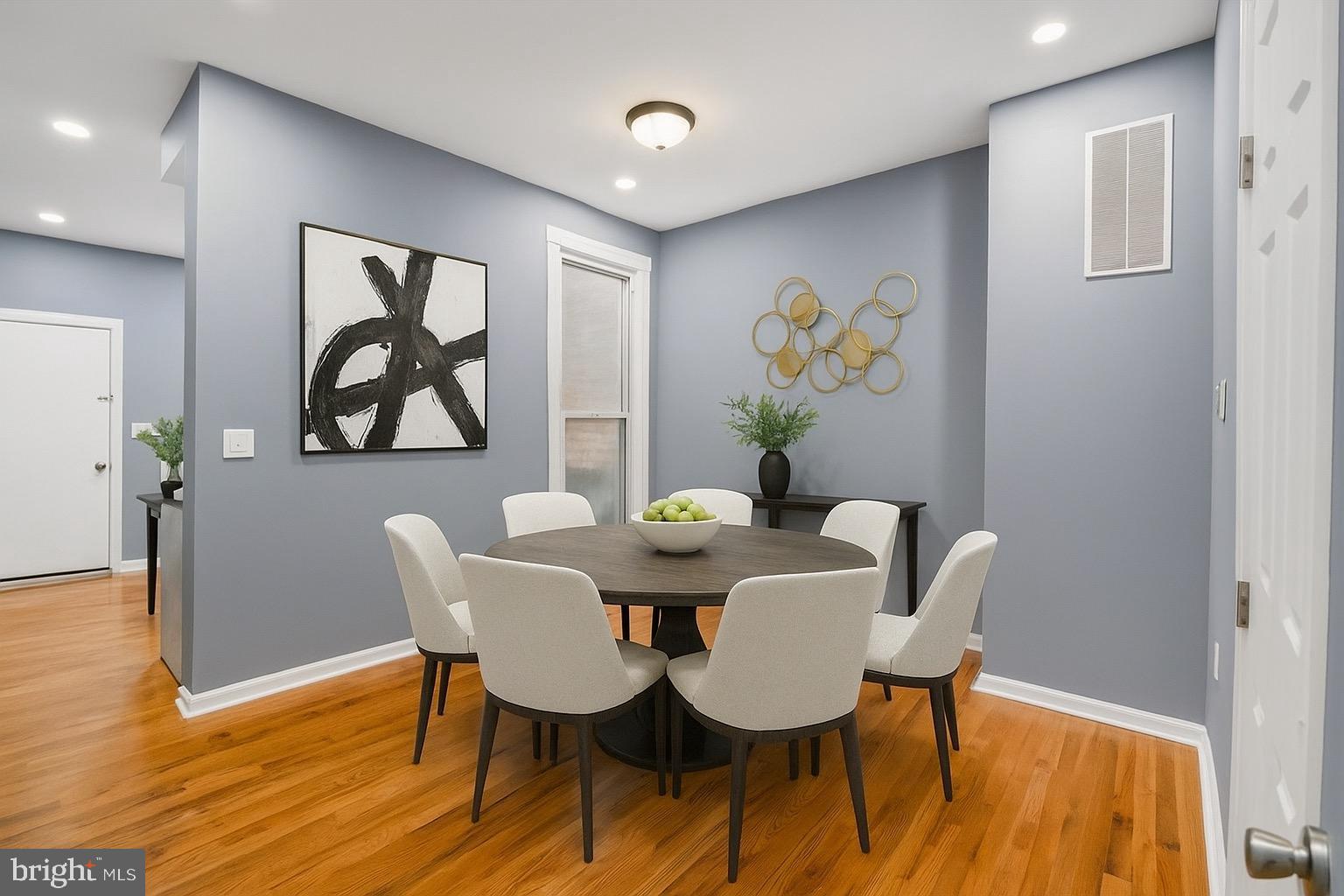1919 Mosher Street Baltimore, MD 21217 - Photo 4 of 21 a view of a dining room with furniture and wooden floor
