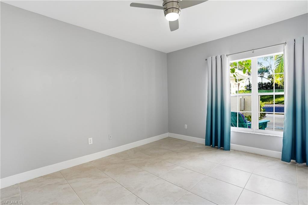 4950 Deerfield Way, Unit 103 Naples, FL 34110 - Photo 22 of 39 a view of an empty room with a window