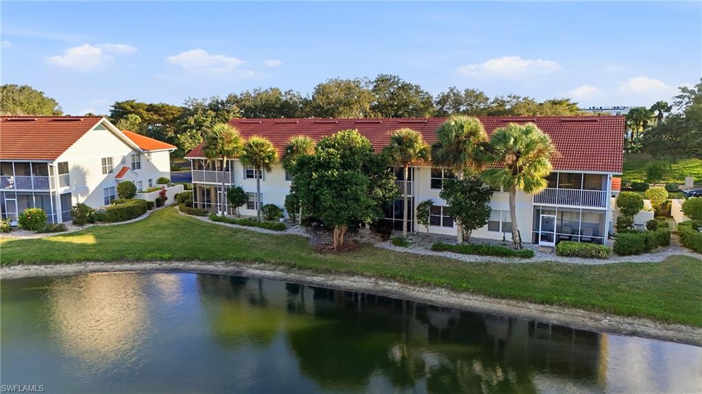 4950 Deerfield Way, Unit 103 Naples, FL 34110 - Photo 27 of 39 an aerial view of residential houses with outdoor space and lake view