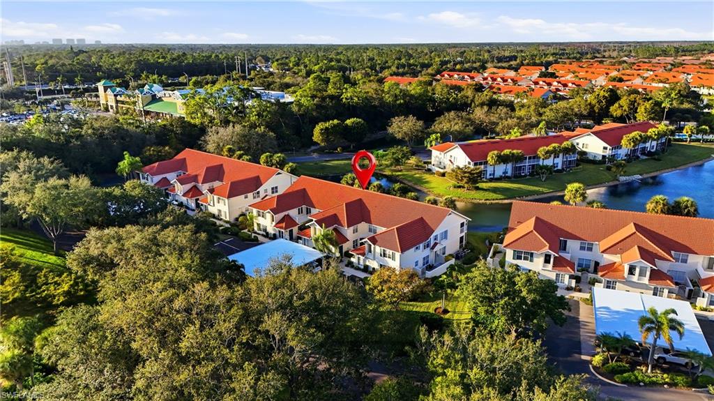 4950 Deerfield Way, Unit 103 Naples, FL 34110 - Photo 28 of 39 an aerial view of multiple house
