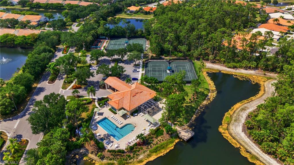 4950 Deerfield Way, Unit 103 Naples, FL 34110 - Photo 30 of 39 an aerial view of a house with outdoor space swimming pool and lake view