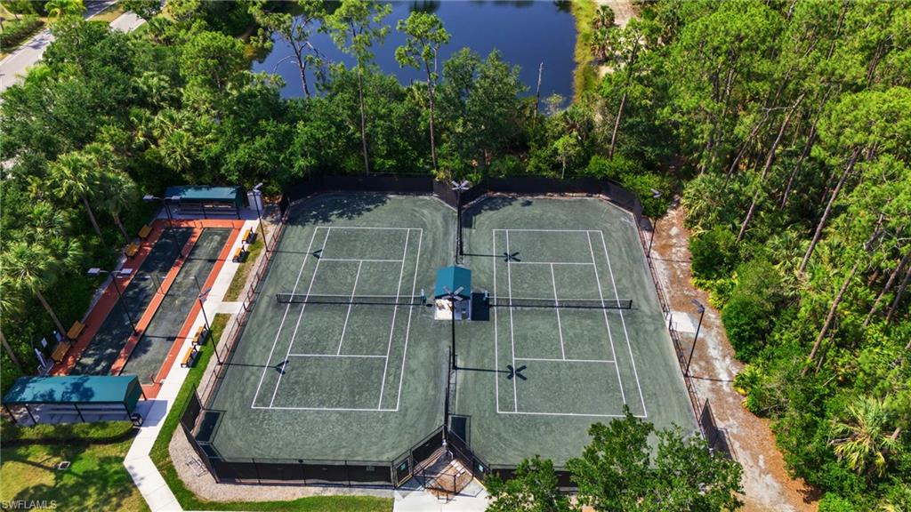 4950 Deerfield Way, Unit 103 Naples, FL 34110 - Photo 33 of 39 a view of a tennis court