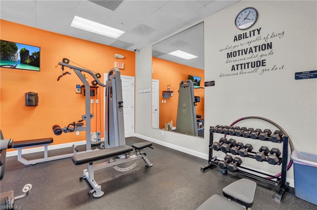 4950 Deerfield Way, Unit 103 Naples, FL 34110 - Photo 38 of 39 a room with gym equipment