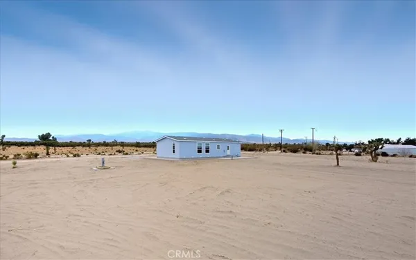 a view of a house with a yard and garage
