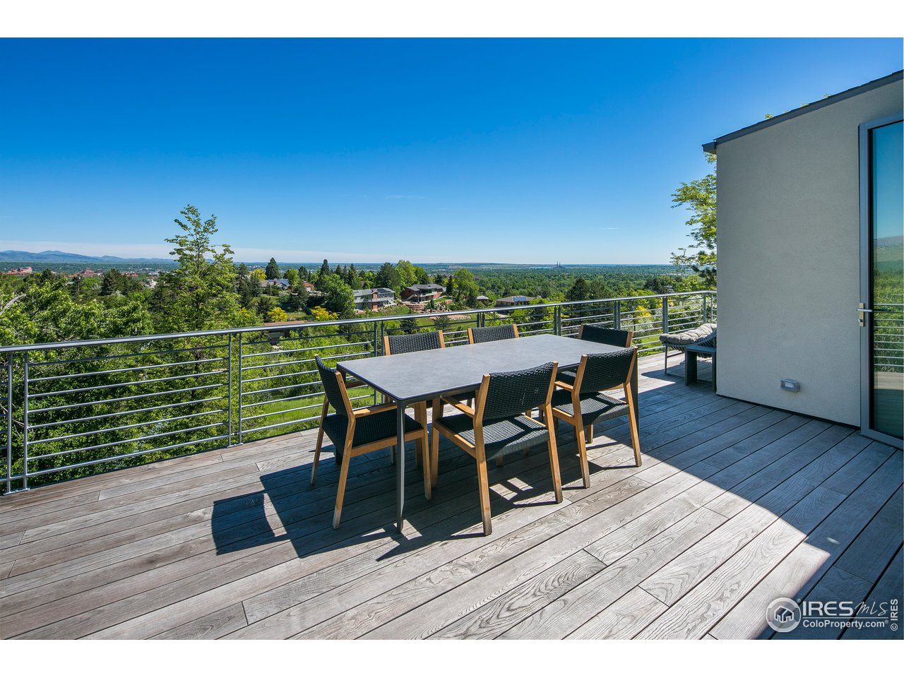 2235 Vassar Drive Boulder, CO 80305 - Photo 11 of 40 a view of a chairs and table on the deck