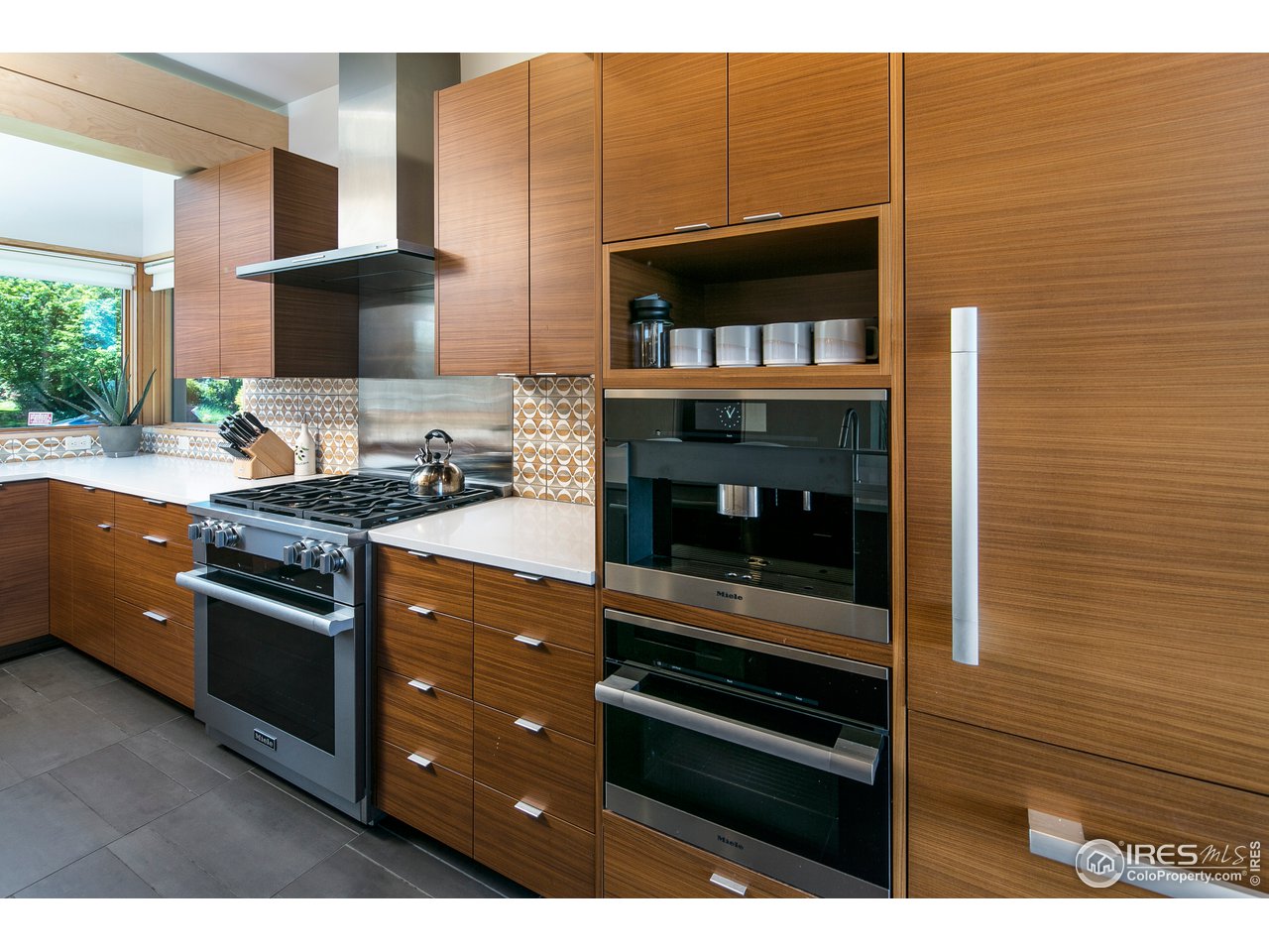 2235 Vassar Drive Boulder, CO 80305 - Photo 16 of 40 a kitchen with stainless steel appliances kitchen island granite countertop a stove and a sink