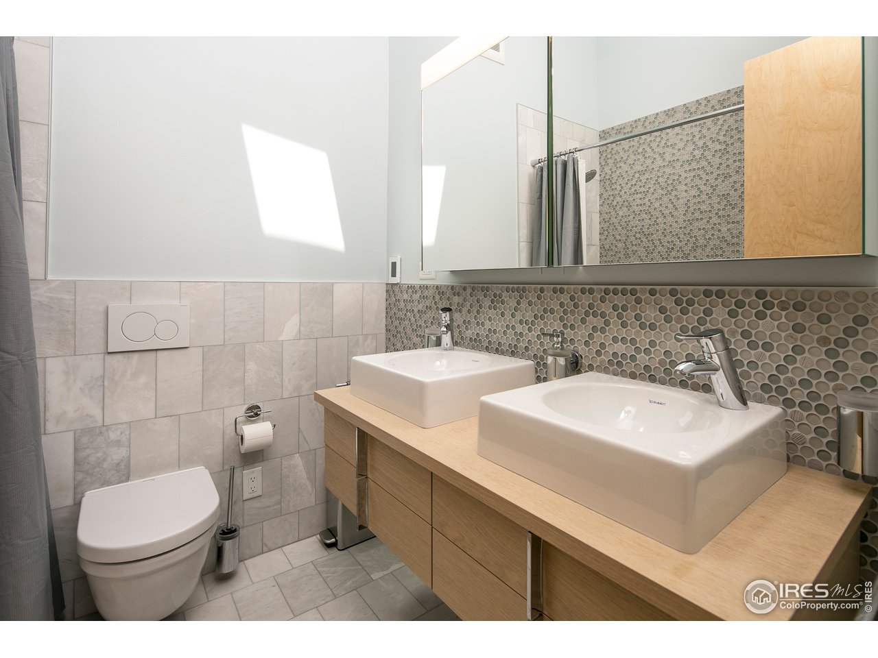 2235 Vassar Drive Boulder, CO 80305 - Photo 19 of 40 a bathroom with a sink mirror vanity and toilet