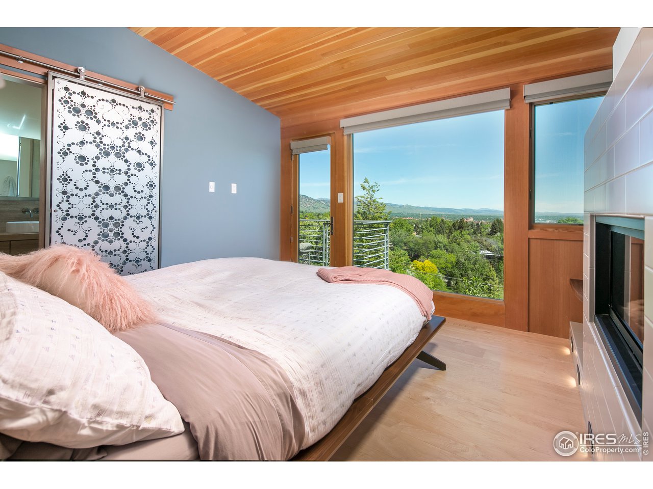 2235 Vassar Drive Boulder, CO 80305 - Photo 20 of 40 a bed sitting in a bedroom next to a window