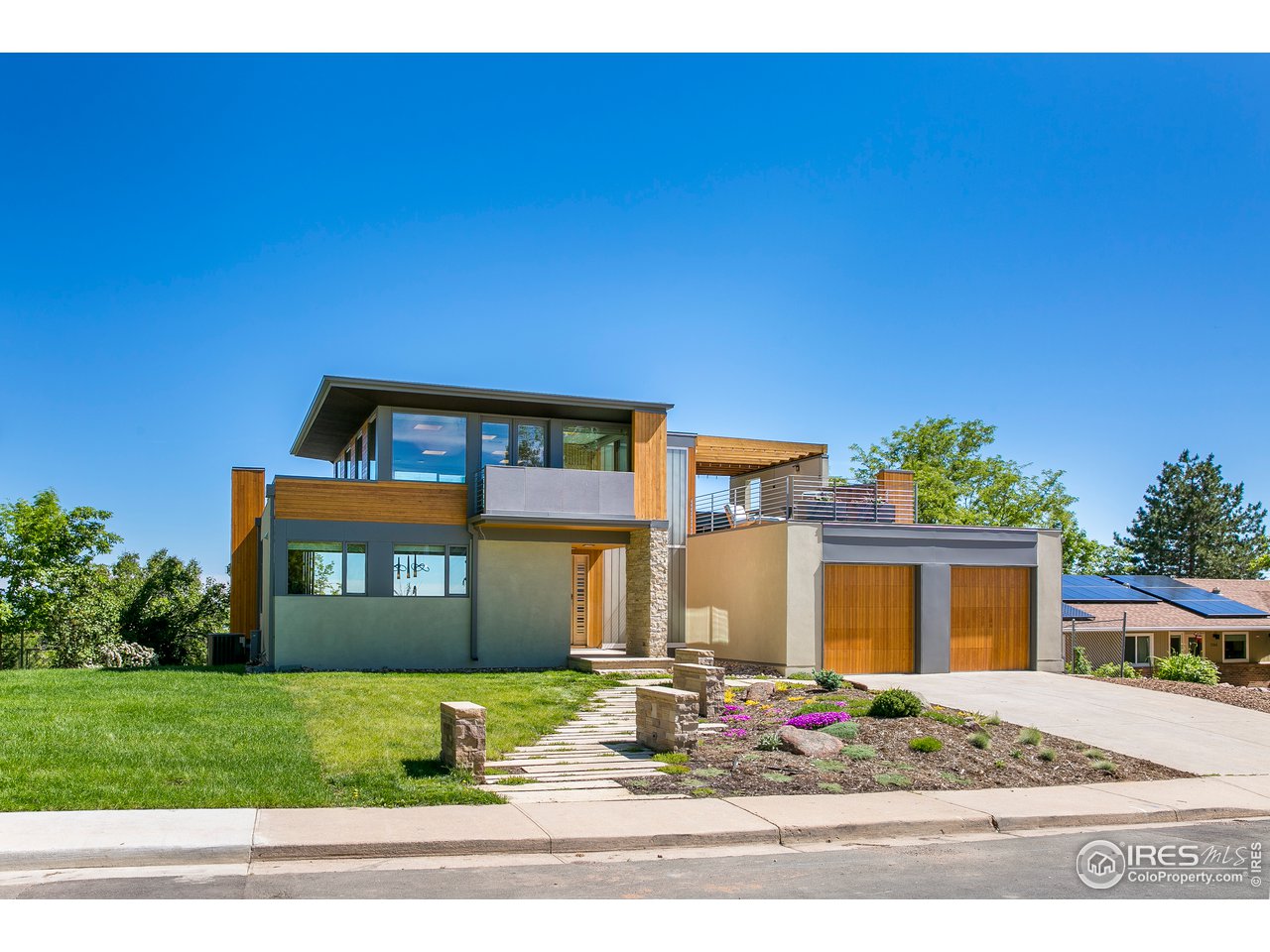 2235 Vassar Drive Boulder, CO 80305 - Photo 2 of 40 a front view of a house with a yard