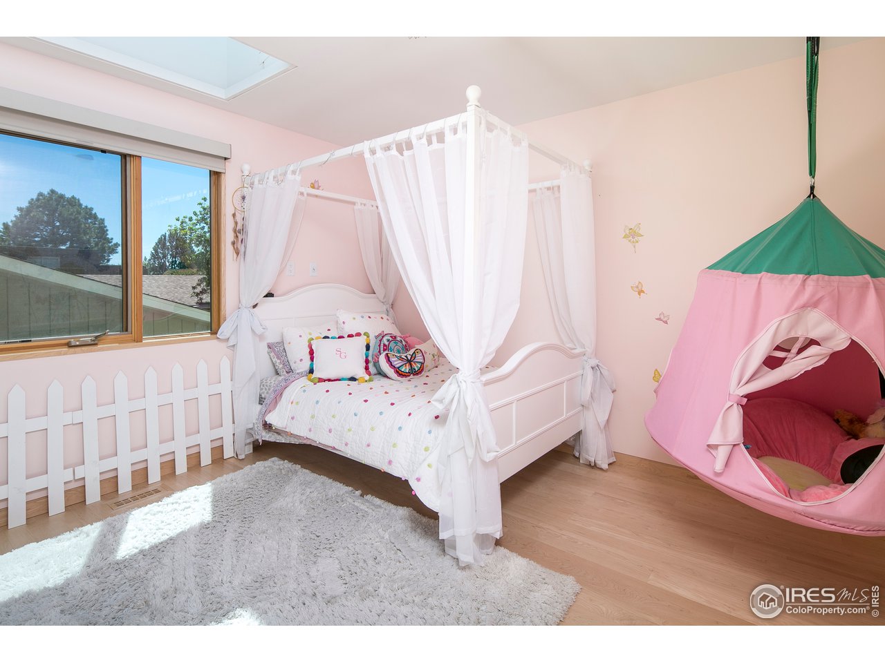 2235 Vassar Drive Boulder, CO 80305 - Photo 24 of 40 a bedroom with a bed and a window