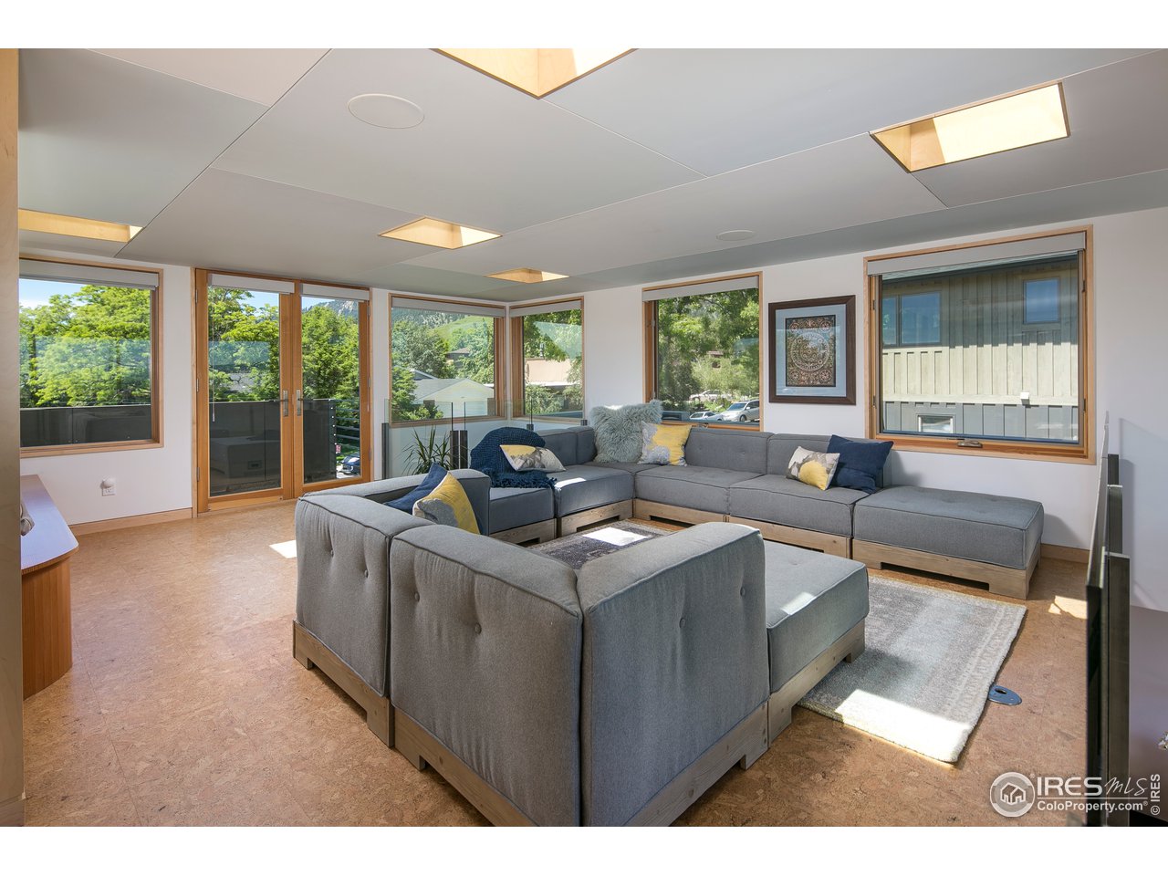 2235 Vassar Drive Boulder, CO 80305 - Photo 25 of 40 a living room with furniture and large windows