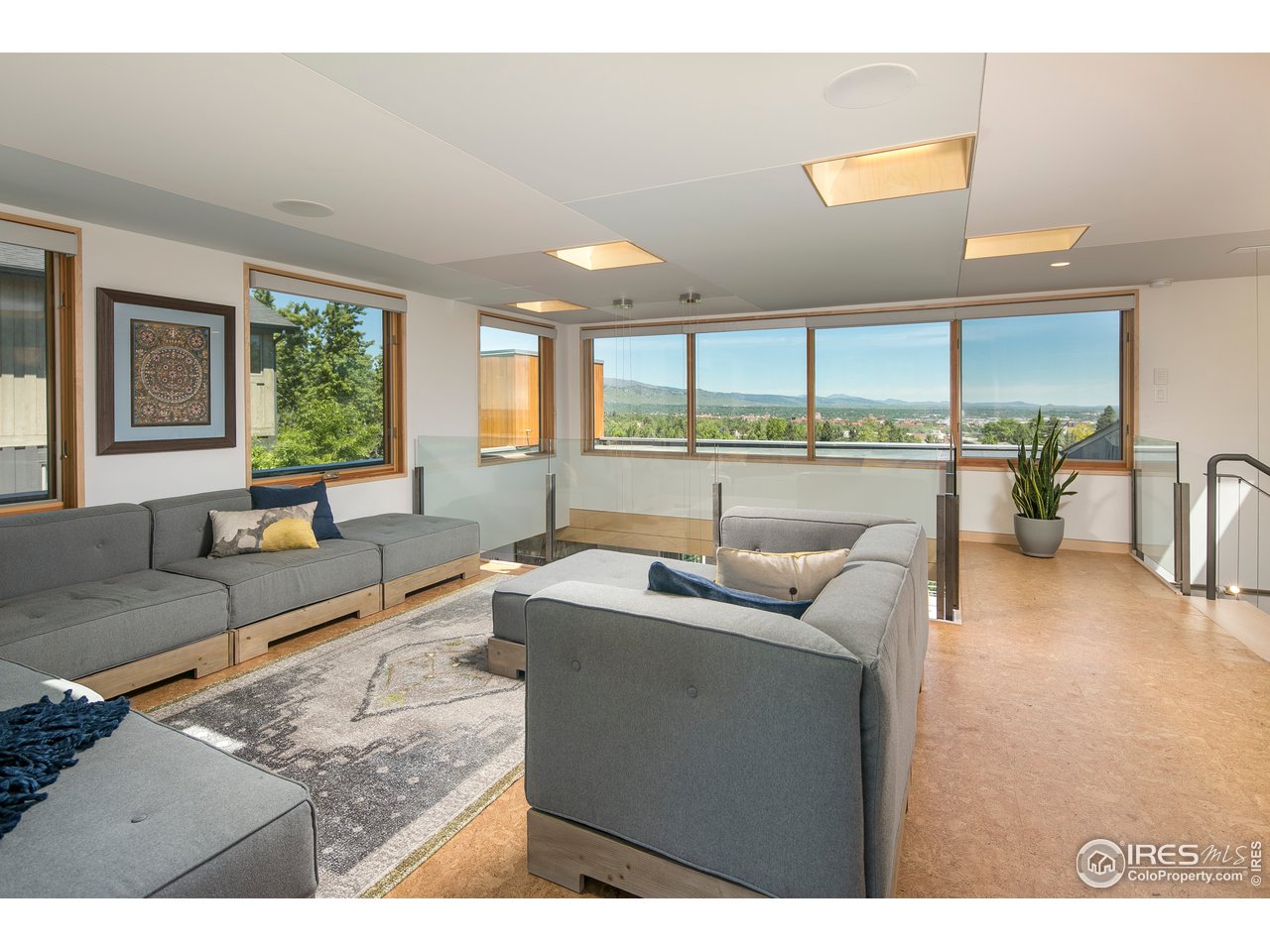 2235 Vassar Drive Boulder, CO 80305 - Photo 26 of 40 a living room with furniture and a large window