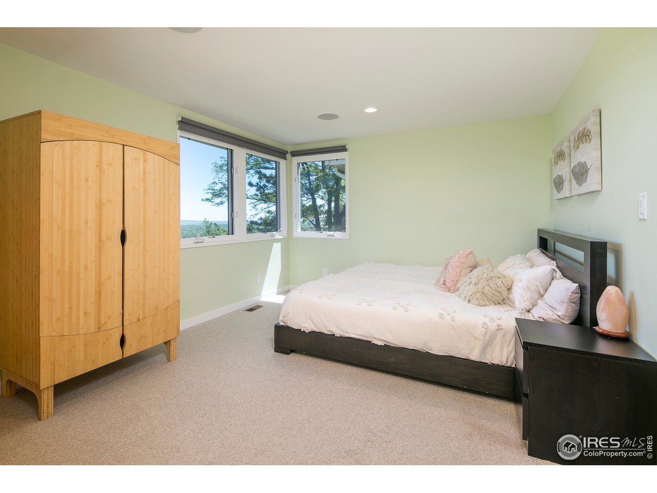 2235 Vassar Drive Boulder, CO 80305 - Photo 33 of 40 a bedroom with a bed and wooden floor