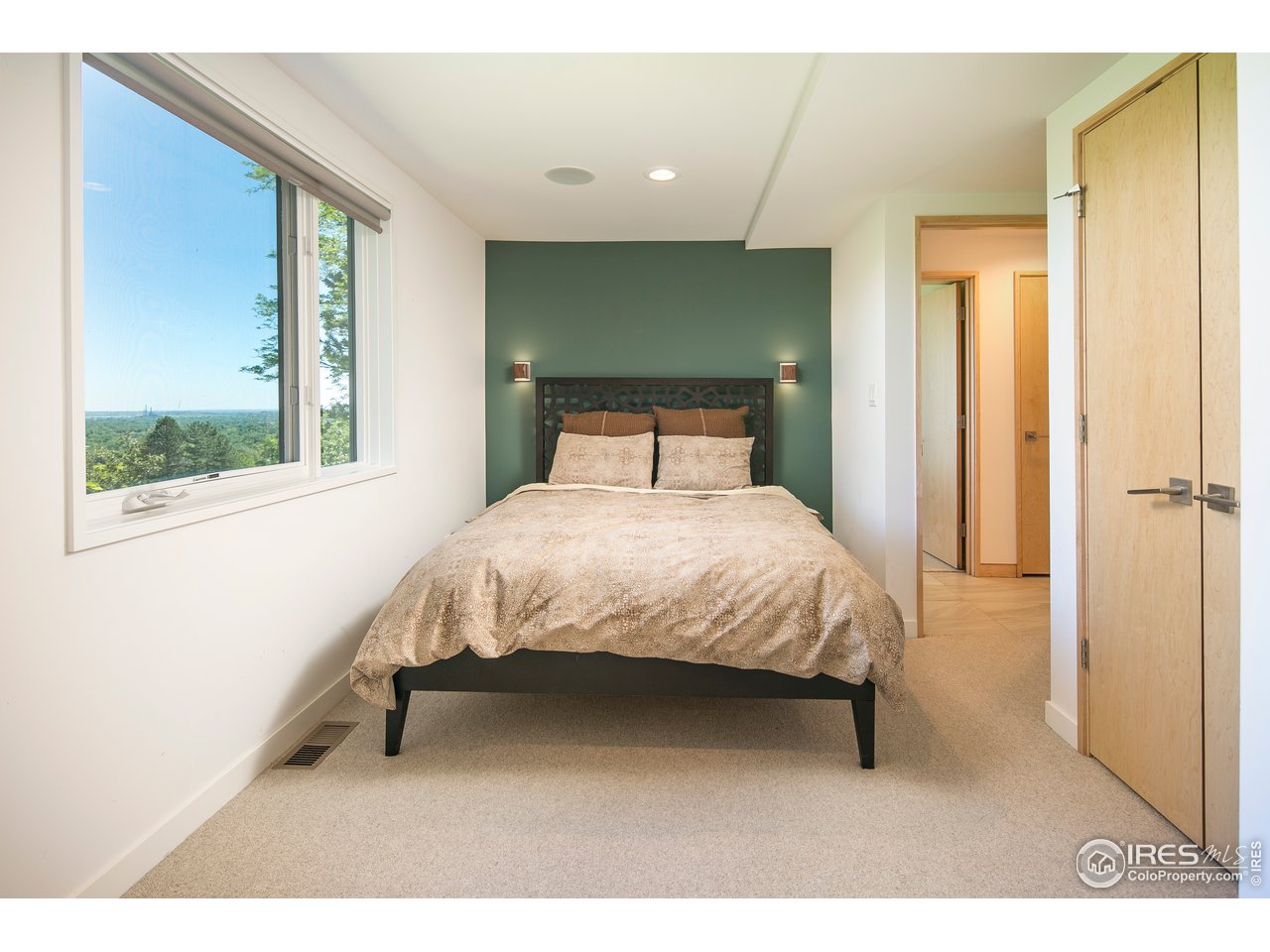 2235 Vassar Drive Boulder, CO 80305 - Photo 34 of 40 a bed sitting in a bedroom next to a window
